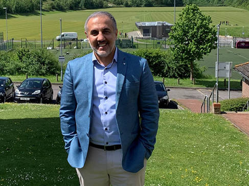 Ambassador Yama Yari with green fields in the background