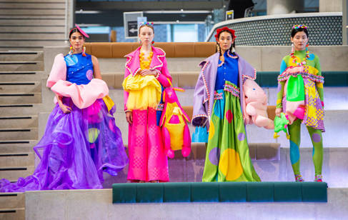 Four models wearing bright clothes by Lottie Allen