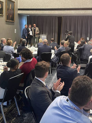 Leon Imber getting his award