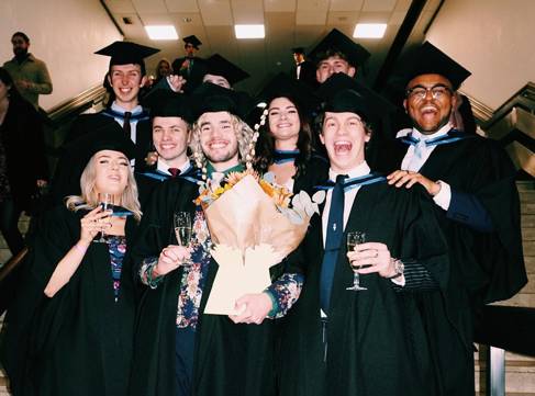 A group of graduates in gowns and hats