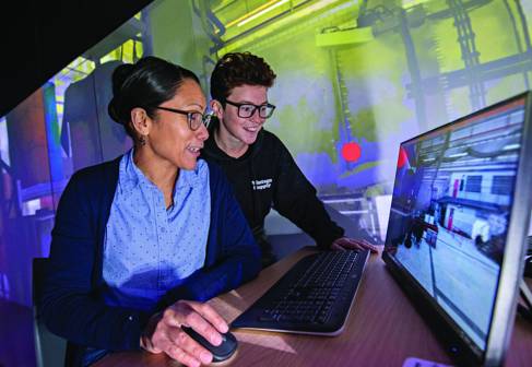 Two students working on a computer